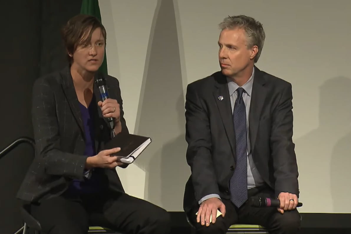 Image of Kate Starbird speaking while seated next to Chris Coward at the Center for an Informed Public launch event