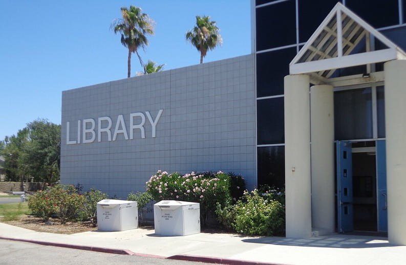 Building with a sign that says "Library"