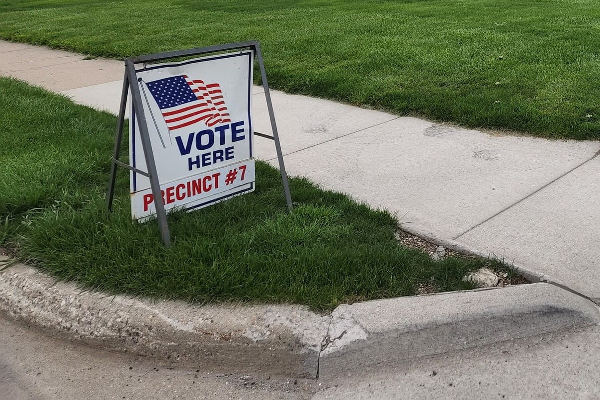 Photo of a sign that says Vote Here: Precinct 7.